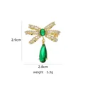 Eleganter Gold-Schleifenbrosche mit grünen Steinen und Zirkonia, 2,9 cm Höhe - B741 Grün/Schleife