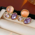 Macro shot of vintage style earrings with orange cat-eye stone and colorful crystals - Orange (Silver Needle)