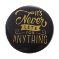 Tinplate pin badge with black matte finish and gold It's Never Late For Anything quote - ITS Never LATE