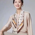 Silk neck scarf with beige base and elegant brown gold floral pattern on model - Beige Art Pattern