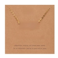 Detail of 18k gold Virgo zodiac necklace displayed on a kraft paper descriptive card - Gold-Virgo