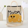 Chic beige knitted tote bag with MOON print, featuring top handles and a long shoulder strap - Beige {Cartoon Face}
