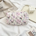 Detailed view of the cream quilted makeup bag with pink hearts and cute cartoon dogs - Puppy Paradise (Beige)