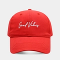 Detailed embroidery of Good Vibes on a vibrant red cotton baseball cap with curved brim - Adjustable / Red