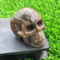 5cm hand-carved unakite crystal skull figurine with natural red and green patterns - Red Sesame