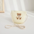 Detail view of a cream straw crossbody bag for kids with a cute bear patch and rope strap - 48-52cm / Woven Crossbody Bag / Cream