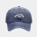 Detailed close-up of white AQUIVER embroidery on navy washed cotton baseball cap - Navy Blue