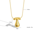Macro shot of 18k gold plated bubble letter T pendant with size 21x16mm and 45cm chain - Letter T