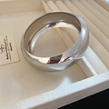 Irregular cutout wide cuff bracelet in polished silver finish on beige display tray - Silver Minimalist Closed Small Style (26#)