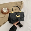 Black woven leather crossbody bag with golden H clasp and striped wide shoulder strap - Black
