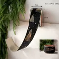 Close-up of black velvet Christmas ribbon with gold foil tree and star patterns - Black Gold Christmas Tree Velvet Ribbon 6.3cm*10 Yards