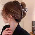 Polished silver metal hair claw clip with elegant twisted design on model - Streamlined Twisted Wave Style / Large / Silver