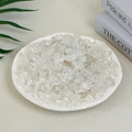 Natural clear quartz crystal irregular chips in a white bowl on a neutral desk - 100g Of Clear White Crystal (9-12mm)