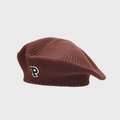 Detailed close-up of the knitted texture and P-letter embroidery on a coffee beret - Brown
