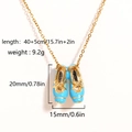 Golden necklace with blue ballet slipper pendants featuring O-chain and product dimensions - Gold Blue