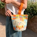 Canvas lunch bag with Donut Rabbit print and vibrant orange handles for daily use - Donut Rabbit