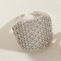 Close-up of wide silver ring with full pavé cubic zirconia and adjustable open band - Round Zirconia Style White Gold / Silver