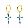 Golden hoop earrings with blue crystal cross pendants on a white reflective surface - Blue Gold