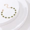 Detail view of colorful daisy flower necklace with gold chain and lobster clasp closure - Small Flower Bracelet / Green