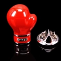 Glossy red boxing glove brooch pin with metallic accents on reflective black background - Boxing Gloves