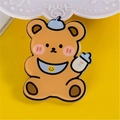 Cute brown cartoon bear acrylic badge with blue beret and milk bottle accessory - Milk Bottle Bear