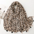 Detail of leopard print scarf featuring soft cotton-linen feel and stylish black fringe edges - Beige