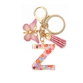 Close-up of resin letter Z keychain with heart sequins and pink butterfly charm - Letter Z