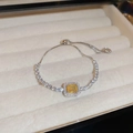 Close-up of yellow rectangular zircon bracelet with silver chain in a velvet box - 21# Bracelet-Silver-Yellow Baguette Halo Style