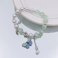 Exquisite pearl and light green bead bracelet with butterfly and star charms on a white tray - S013-blue-green Butterfly Pendant Pearl Bursting Bracelet #sz153