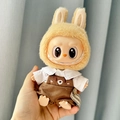 Labubu plush doll wearing yellow bunny ears hoodie and brown suspenders outfit - White Collared Shirt + Dog-skin Overalls / First And Second Generation Keychains Are Compatible With La Cloth Dolls. Dolls Not Included.
