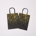 Premium black kraft paper gift bags with elegant gold heart pattern and rope handles - Black Card Single-Sided Bronzing Heart