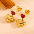 Macro view of gold heart drop earrings with red zircon and vertical textured relief - Gold Red Zircon Heart (238305-1)