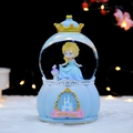Luminous blue princess crystal ball with castle base and golden crown decoration - 2434 Blue Dress / Large Size 100+ Spins + Snow + Colored Lights + Music