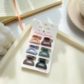 Set of 6 matte mini hair claws in assorted colors on a cat-patterned display card - Semicircle A 2.7cm