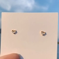 Elegant gold heart stud earrings featuring three small clear stones on display card - 925 Silver Needle / Gold Hollow Heart Stud Earrings