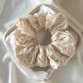 Beige floral lace scrunchie with HAND MADE label in a pulp box over white silk - 69# Warm Yellow Floral