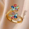 Macro shot of gold flower ring with colorful zircons on soft champagne silk fabric - Gold Multicolor Double Flower (G3014353)