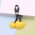 Yellow cherry leather keychain with black leaves on a colorful pastel background - Green Stem Yellow Fruit