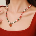Christmas necklace with red green beads and a brown reindeer enamel charm for festive wear - D1217 Single Layer Beaded Brown Elk Pendant