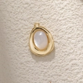 Irregular gold-plated copper pendant with oval white mother of pearl inlay on stone surface - A0358 Gold Mother of Pearl Irregular Oval