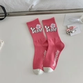 Pink mid-calf socks with white cartoon motifs and stylized lettering on a white surface - One Size / Pink - YEAH