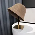 Light khaki crochet bucket hat with hollow weave on a minimalist gold stand - Honeycomb Style / Khaki