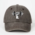 Detail of grey washed baseball cap showing dumbbell gym print and vintage cotton texture - Coffee