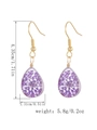 Handmade gold hook earrings with teardrop resin charms featuring dried purple flowers - Pear Shape Pendant / Purple
