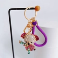 Macro detail of koala keychain with pink rhinestones and purple woven rope handle - Purple with Heart Lanyard / Purple