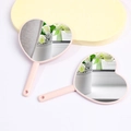 Set of two pink heart-shaped handheld mirrors with durable plastic frames in a studio setting - 8x12cm / Pink