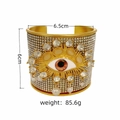 Detailed view of vintage Evil Eye rhinestone wide cuff bangle with weight and size info - Brown Eye