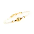 Detail of beaded bracelet with 4mm white shell beads and 8mm gold brushed textured bead - White Shell Round Bead