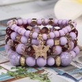 Böhmisches mehrlagiges lila Perlenarmband mit Kristallperlen und goldenem Schmetterling - Lila