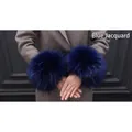 Faux fur wrist cuff in dark blue jacquard style paired with a stylish khaki coat - Blue Jacquard